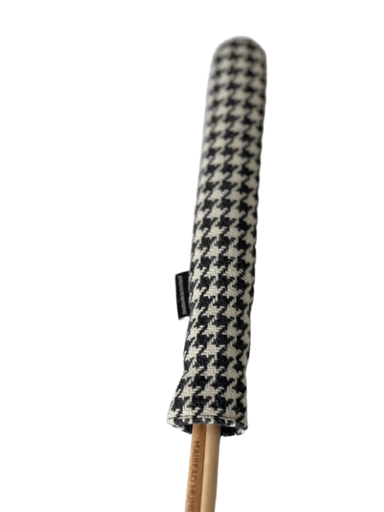 Mairead Hume® Black &amp; White Houndstooth Harris Tweed® Golf Alignment Stick Cover — angled view showing cover on two alignment sticks