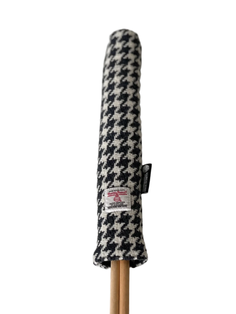 Mairead Hume® Black &amp; White Houndstooth Harris Tweed® Golf Alignment Stick Cover — upright product shot showing Harris Tweed® Orb label, handmade in Scotland
