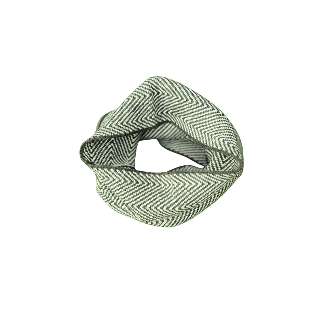 Green and white patterned neck gaitor on a white background